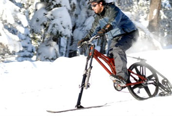 Ktrak ski bike. Man riding the ktrakcycle.