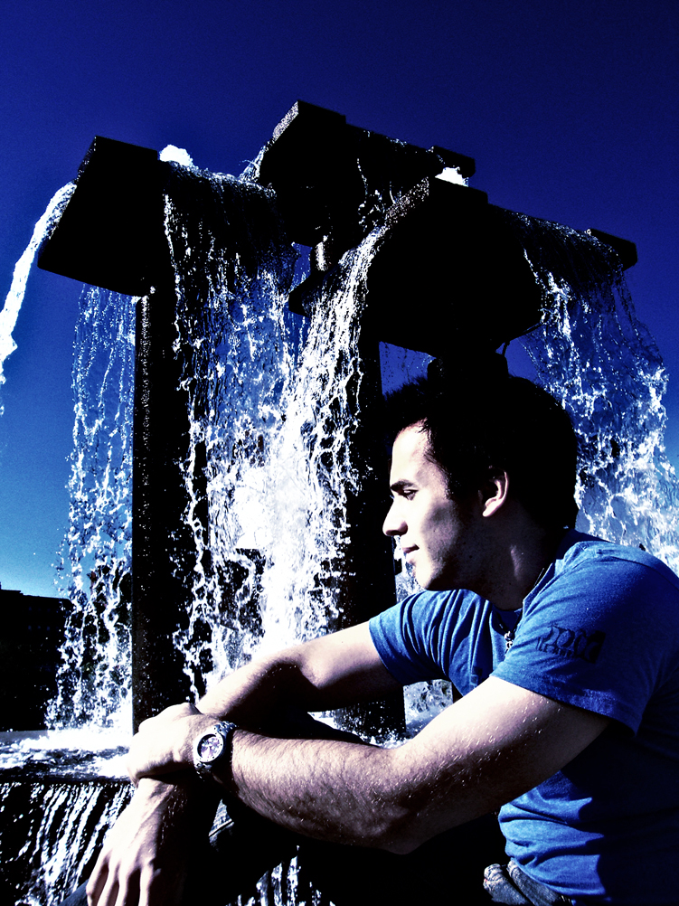 Man behind a water fountain.